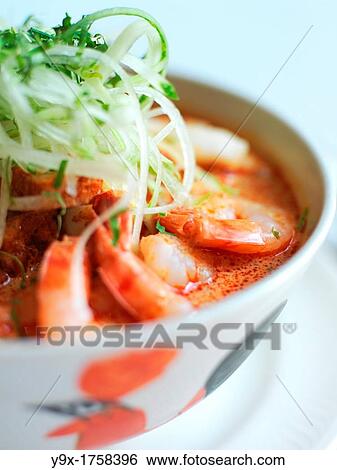 Laksa, a popular spicy noodle soup from Peranakan culture, which is a merger of Chinese and Malay elements found in Singapore View Large Photo Image Stock Photograph - Laksa, a popular spicy noodle soup from Peranakan culture, which is a merger of Chinese and Malay elements found in Singapore. Fotosearch