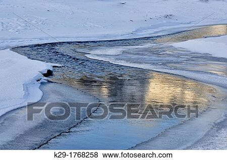 Lamar river with snow drifts in late winter, Yellowstone NP, Wyoming, USA View Large Photo Image Stock Photo - Lamar river with snow drifts in late winter, Yellowstone NP, Wyoming, USA. Fotosearch