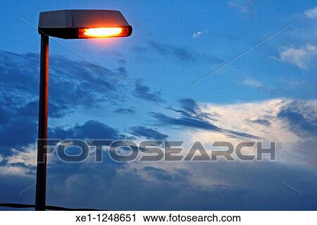 Lamp lit at dawn. View Large Photo Image Stock Image - Lamp lit at dawn.. Fotosearch