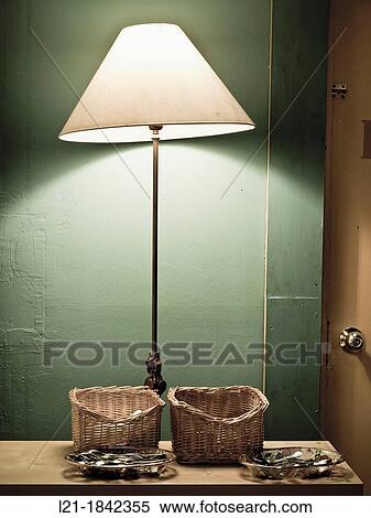 Lamp, two baskets, Cutlery, table, green wall. View Large Photo Image Stock Photography - Lamp, two baskets, Cutlery, table, green wall.. Fotosearch