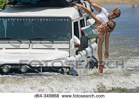 Stock Photo - Land Rover crossing river on the North coast of Brazil. Fotosearch
