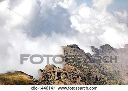 Landscape in the Simien Mountains National Park Clouds are moving up at the edge of the escarpment forming a dramatic background View Large Photo Image Stock Photo - Landscape in the Simien Mountains National Park Clouds are moving up at the edge of the escarpment forming a dramatic background. Fotosearch