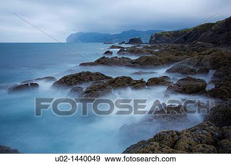 Landscape of rocks and water on the coast of Basque Country View Large Photo Image Stock Photo - Landscape of rocks and water on the coast of Basque Country. Fotosearch