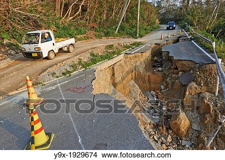 Picture - Landslide damage caused by typhoons and torrential rains on a mountain road in Okinawa.. Fotosearch
