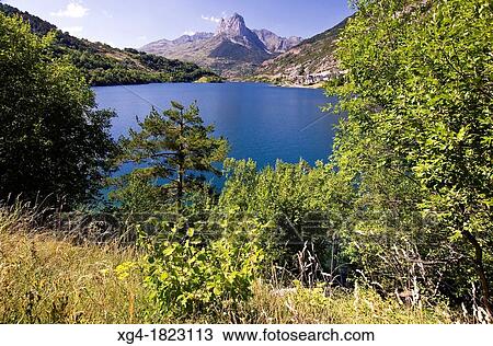 Lanuza Reservoir and Pea Foratata in background - Valle de Tena - Pyrenees - Huesca province - Aragon - Spain - Europe View Large Photo Image Stock Image - Lanuza Reservoir and Pea Foratata in background - Valle de Tena - Pyrenees - Huesca province - Aragon - Spain - Europe. Fotosearch