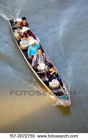 Lao people taking rice to market on the river in Paske, Laos. View Large Photo Image Stock Photography - Lao people taking rice to market on the river in Paske, Laos.. Fotosearch