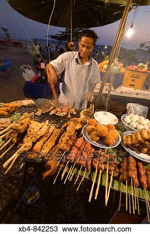 Laos, Vientiane, street restaurant along Mekong river at the sunset View Large Photo Image Stock Image - Laos, Vientiane, street restaurant along Mekong river at the sunset. Fotosearch