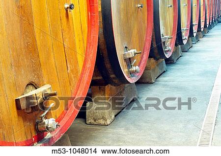 large size wooden aging barrells in a large underground winery View Large Photo Image Picture - large size wooden aging barrells in a large underground winery. Fotosearch