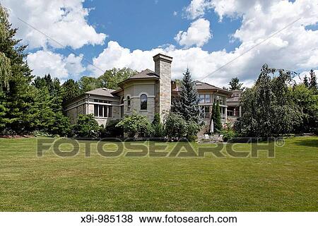 Large suburban stone home with terrace and patio View Large Photo Image Stock Photo - Large suburban stone home with terrace and patio. Fotosearch