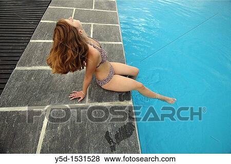 last days of summer at the swimming pool, one young woman View Large Photo Image Stock Photo - last days of summer at the swimming pool, one young woman. Fotosearch