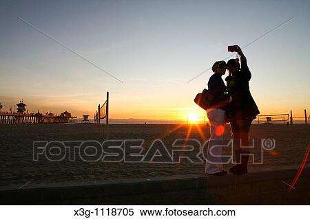 Late afternoon at the Huntington Beach Pier, California, USA View Large Photo Image Stock Photography - Late afternoon at the Huntington Beach Pier, California, USA. Fotosearch