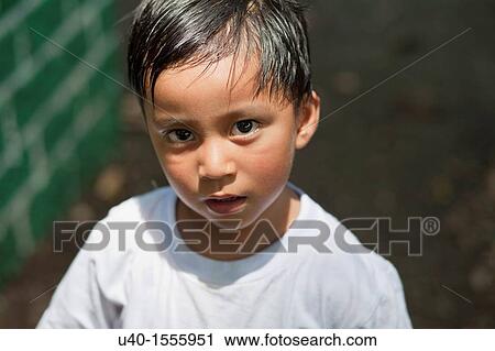 Stock Image - Latin boy in White T-shirt. Fotosearch