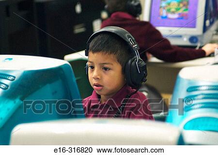 Latin boy on computer View Large Photo Image Stock Image - Latin boy on computer. Fotosearch