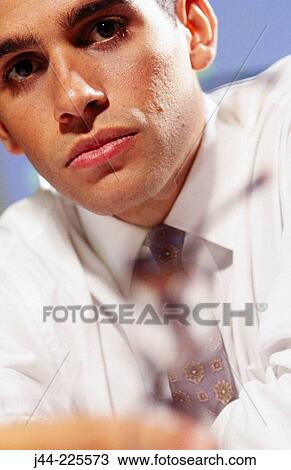 Latin businessman holding a glass View Large Photo Image Stock Image - Latin businessman holding a glass. Fotosearch