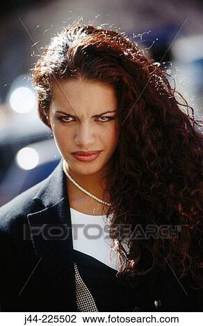 Stock Image - Latin businesswoman in the street. Fotosearch