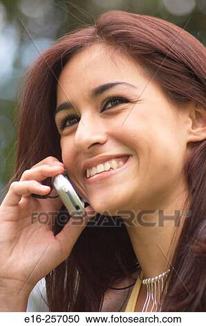 Latin girl on phone View Large Photo Image Stock Image - Latin girl on phone. Fotosearch