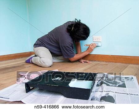 Latin-Italian woman painting wall View Large Photo Image Stock Photograph - Latin-Italian woman painting wall. Fotosearch
