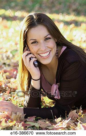 Stock Image - Latin lady on phone. Fotosearch
