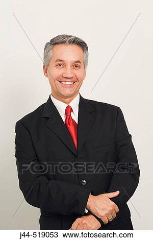 Latin man with black suit smiling View Large Photo Image Stock Image - Latin man with black suit smiling. Fotosearch