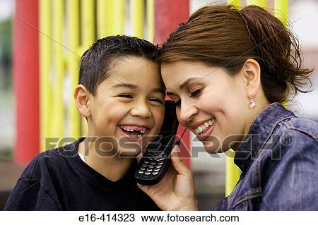 Latin mother and son on cell phone View Large Photo Image Stock Image - Latin mother and son on cell phone. Fotosearch