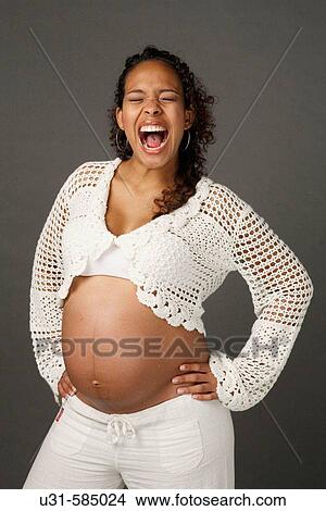 Picture - Latin pregnant woman shouting.. Fotosearch