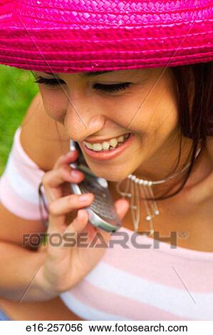 Latin teen on phone View Large Photo Image Stock Photograph - Latin teen on phone. Fotosearch