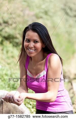 Latin woman drinking at a fountain. View Large Photo Image Stock Photography - Latin woman drinking at a fountain.. Fotosearch