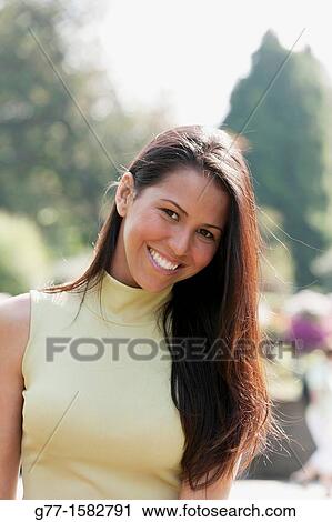 Latin woman in a park. View Large Photo Image Stock Image - Latin woman in a park.. Fotosearch