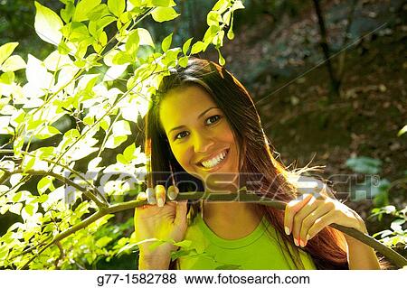 Stock Photo - Latin woman in a park.. Fotosearch