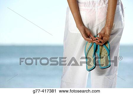 Stock Image - Latin woman on the beach. Key Byscaine. Miami. Florida. USA.. Fotosearch