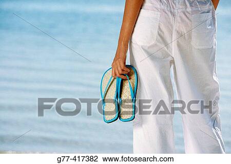 Stock Image - Latin woman on the beach. Key Byscaine. Miami. Florida. USA.. Fotosearch
