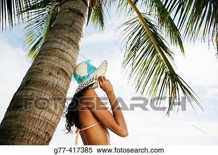 Stock Photography - Latin woman on the beach. Key Byscaine. Miami. Florida. USA.. Fotosearch