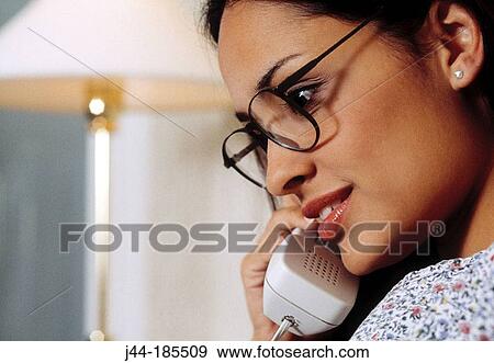 Latin woman on the phone View Large Photo Image Stock Photo - Latin woman on the phone. Fotosearch