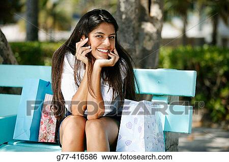 Latin woman with shopping bags in Ocean Drive. Art Deco district, South Beach, Miami Beach. Florida, USA View Large Photo Image Stock Photograph - Latin woman with shopping bags in Ocean Drive. Art Deco district, South Beach, Miami Beach. Florida, USA. Fotosearch