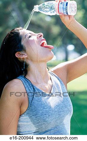 Latino lady cooling off View Large Photo Image Picture - Latino lady cooling off. Fotosearch