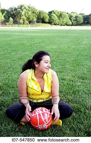 Latino woman holding soccer ball - football View Large Photo Image Stock Image - Latino woman holding soccer ball - football. Fotosearch