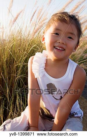 Laughing asian girl View Large Photo Image Stock Image - Laughing asian girl. Fotosearch