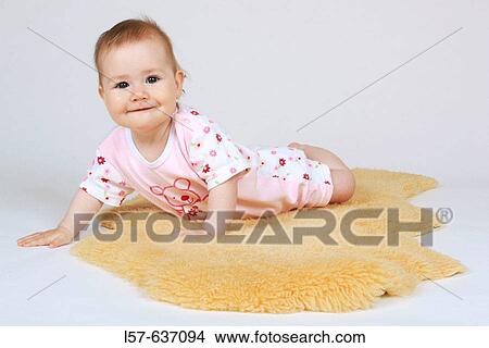 laughing baby, crawling, on sheep skin, Studio, Oetwil am See, Zuerich, Switzerland View Large Photo Image Picture - laughing baby, crawling, on sheep skin, Studio, Oetwil am See, Zuerich, Switzerland. Fotosearch