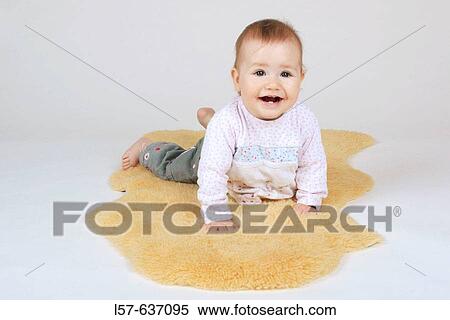 laughing baby, crawling, on sheep skin, Studio, Oetwil am See, Zuerich, Switzerland View Large Photo Image Stock Photography - laughing baby, crawling, on sheep skin, Studio, Oetwil am See, Zuerich, Switzerland. Fotosearch
