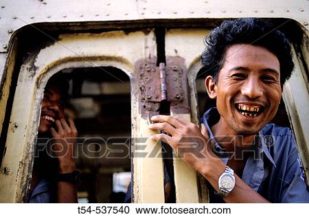 Laughing Burmese man in bus View Large Photo Image Stock Image - Laughing Burmese man in bus. Fotosearch