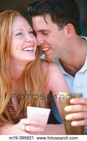 laughing couple having a drink View Large Photo Image Stock Image - laughing couple having a drink. Fotosearch