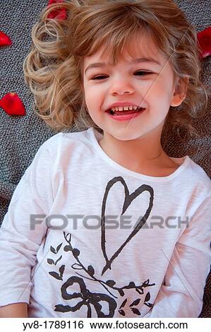 Laughing four year old blonde girl View Large Photo Image Stock Photograph - Laughing four year old blonde girl. Fotosearch