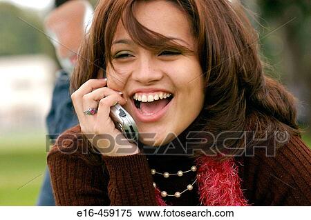 laughing Hispanic lady on phone View Large Photo Image Stock Photography - laughing Hispanic lady on phone. Fotosearch