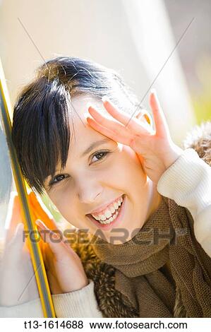 Stock Photo - Laughing young woman portrait. Fotosearch