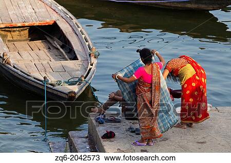 Laundry at the River Ganges in Varanasi, India View Large Photo Image Stock Image - Laundry at the River Ganges in Varanasi, India. Fotosearch