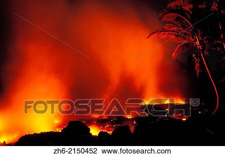 Stock Image - Lava flow entering the Pacific Ocean at night, Hawaii Volcanoes National Park, The Big Island, Hawaii USA.. Fotosearch