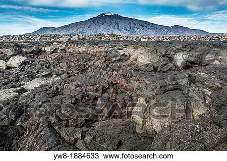 Stock Image - Lava rock landscape with Snaefellsjokull in the background, Snaefellsnes Peninsula, Iceland. Fotosearch