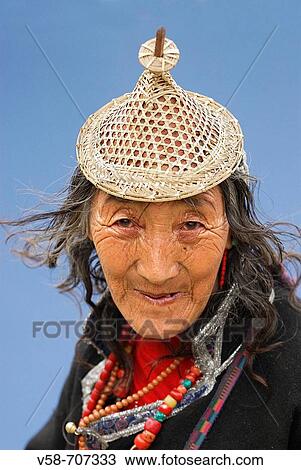 Stock Image - Laya old woman wearing the traditional bamboo hat, punakha, Bhutan. Fotosearch