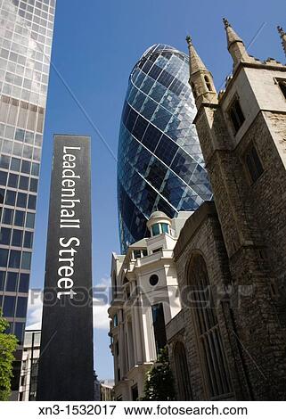 Leadenhall Street, on background 30 St Mary Axe, also known as the Swiss Re Tower or The Gherkin, Norman Foster architect, City of London, London, England, UK. View Large Photo Image Stock Photo - Leadenhall Street, on background 30 St Mary Axe, also known as the Swiss Re Tower or The Gherkin, Norman Foster architect, City of London, London, England, UK.. Fotosearch