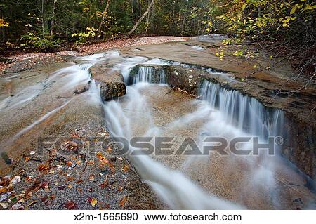 Ledge Brook during the autumn months in the White Mountains, New Hampshire USA This brook is located off of the Kancamagus Scenic Byway, which is one of New England's scenic byways View Large Photo Image Stock Image - Ledge Brook during the autumn months in the White Mountains, New Hampshire USA This brook is located off of the Kancamagus Scenic Byway, which is one of New England's scenic byways. Fotosearch